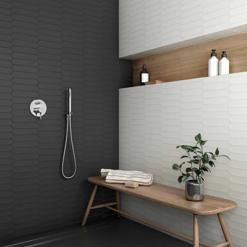 Stylish small bathroom featuring elegant tile designs that enhance space and brightness.