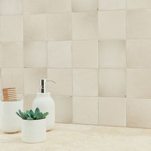 Zellige Heritage Ceramic Distressed Wall Tile Sand 4x4 featured on a bathroom backsplash