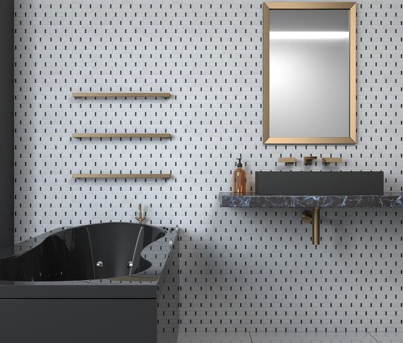 Subway Dots Stone Mosaic Tile Black and White featured on a bathroom with gold framed mirror and hardware