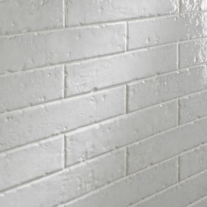 Modern Farmhouse Brick Porcelain Tile Vanille 2x9 featured on an accent wall