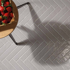 Modern Farmhouse Brick Porcelain Tile Alabaster 2x9 featured on a floor