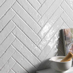 Modern Farmhouse Brick Porcelain Tile White 2x9 featured on an accent wall