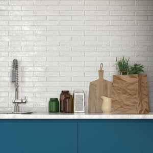 Modern Farmhouse Brick Porcelain Tile White 2x9 featured on kitchen backsplash with blue cabinets