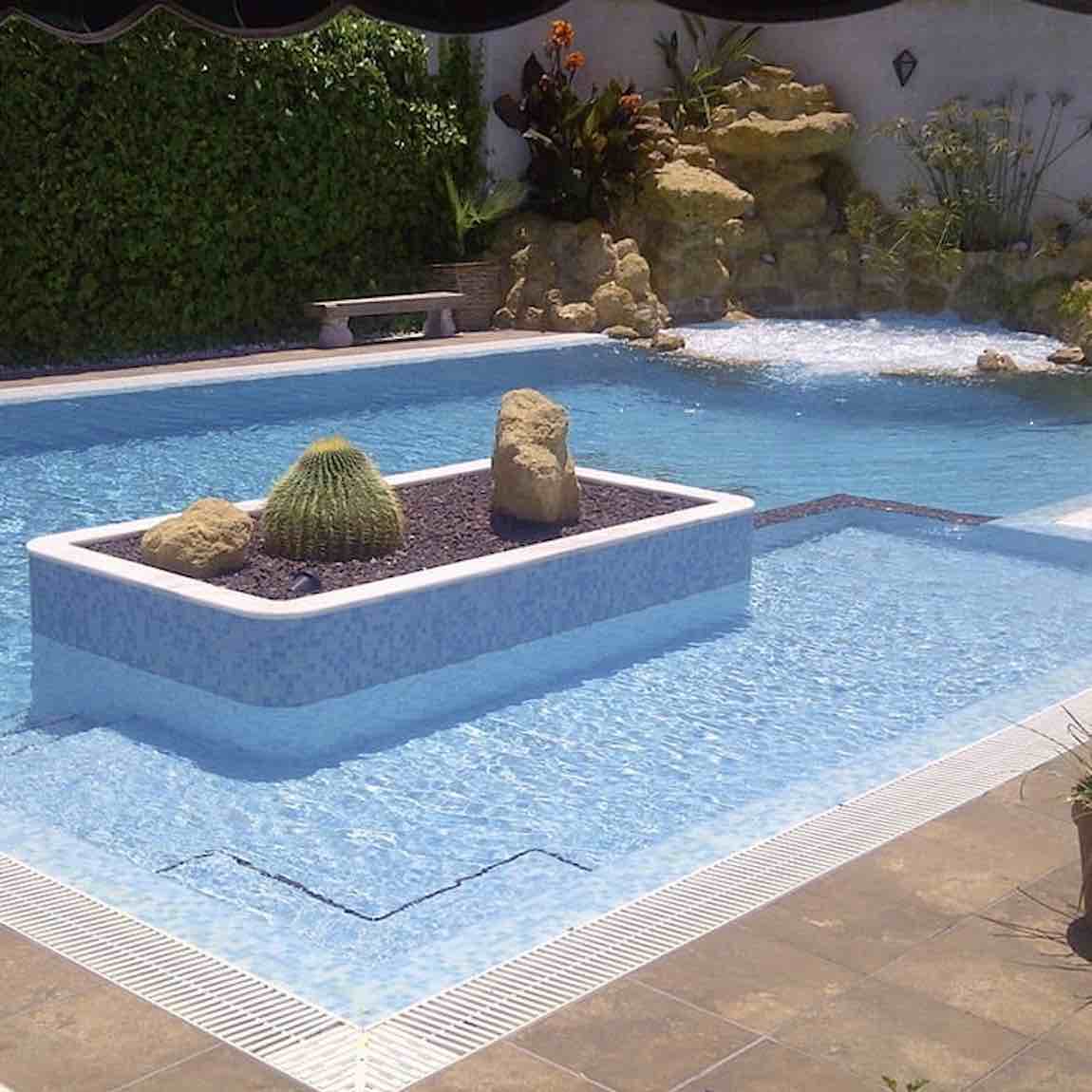 Celestial Blue Swimming Pool featuring a rock waterfall