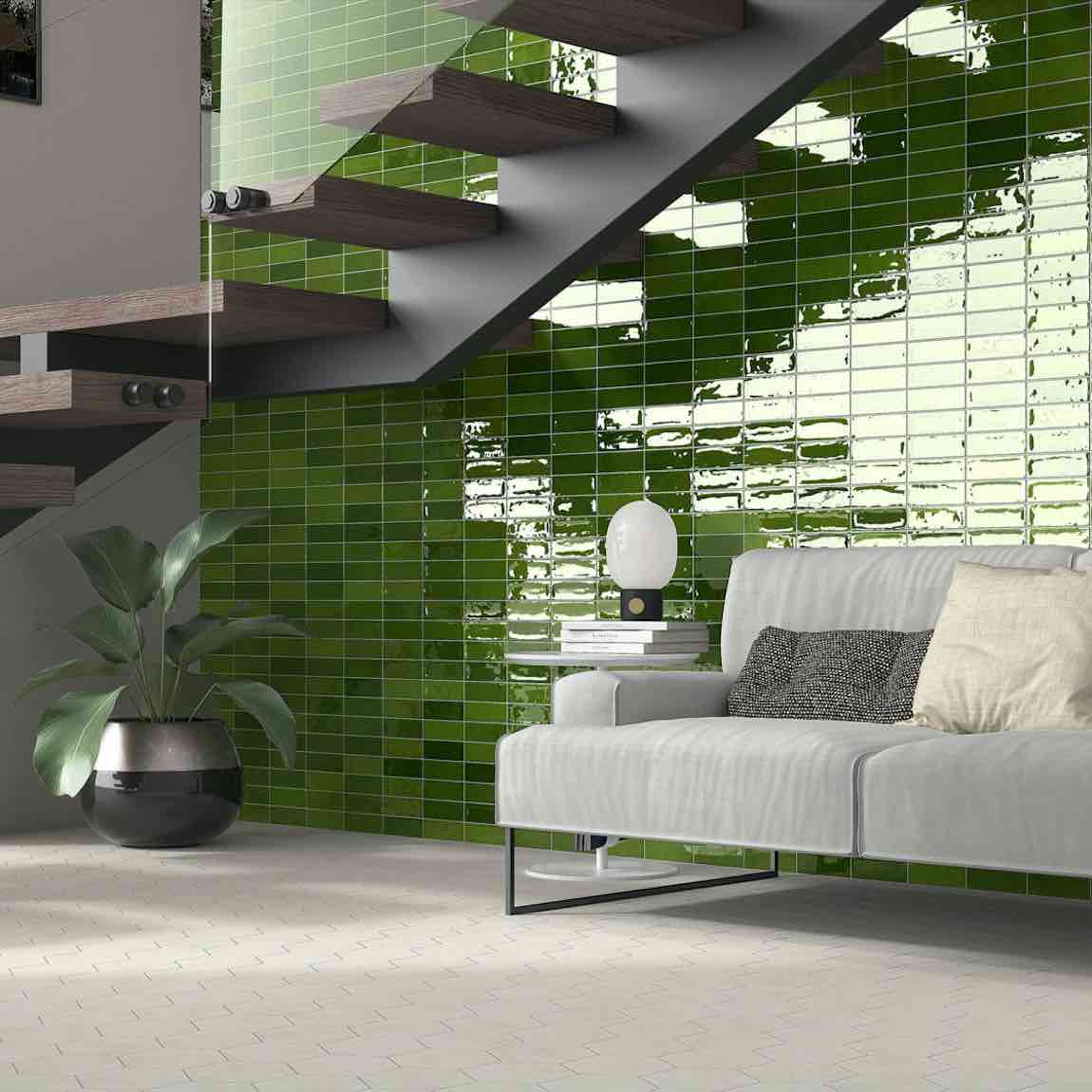 Petite Ville Subway Porcelain Tile Olive 2x6 featured on a living room accent wall