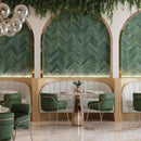 Zellij Distressed Subway Tile Rainforest 2.8x11 featured as a herringbone pattern on a restaurant feature wall