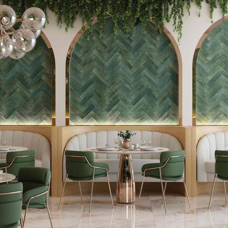 Zellij Distressed Subway Tile Rainforest 2.8x11 featured as a herringbone pattern on a restaurant feature wall