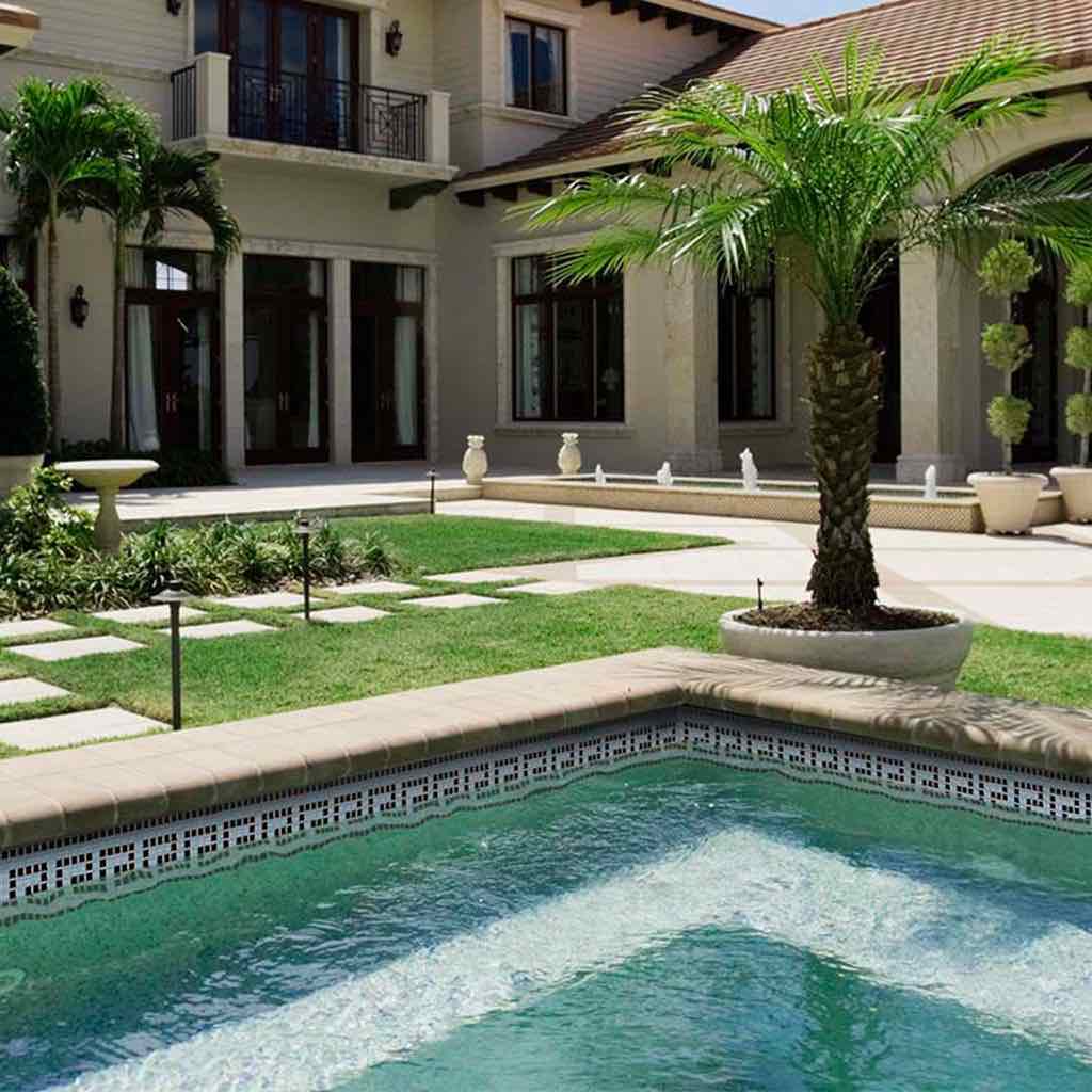 Pool Waterline Glass Tile Blue and White 5/8x5/8 installed on a mediterranean swimming pool